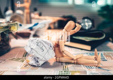 Crump paper calendar with the word holiday written on. Cancel and fail plan Travel, holiday, vocation and new year concept. Stock Photo