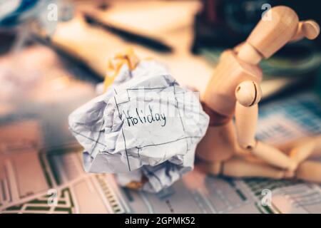 Crump paper calendar with the word holiday written on. Cancel and fail plan Travel, holiday, vocation and new year concept. Stock Photo