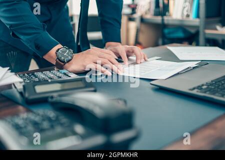 Businessman working on office desk and analyzing new project of accounting finance. Investment, Financial advisor and accounting concept. Stock Photo