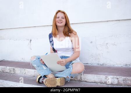 Teenage Girl Draws Sketchbook While Sitting Stock Photo 2034569108