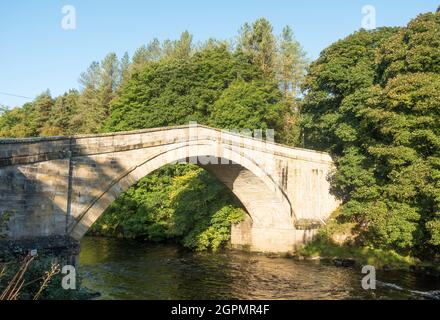 Featherstone Bridge, an 18th century stone arch bridge over the river South Tyne in Northumberland, England, UK Stock Photo