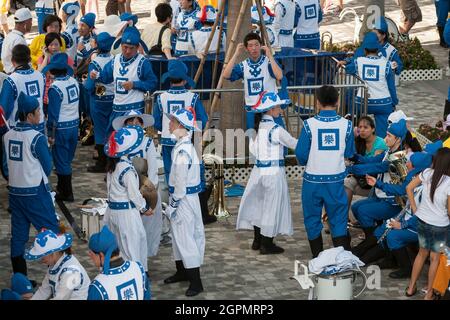 Practitioners of Falun Gong gather  for a celebration in Tsim Sha Tsui, Kowloon, Hong Kong Stock Photo