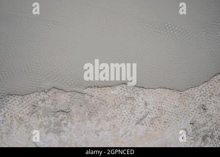 floor partially covering with self-levelling cement mortar Stock Photo