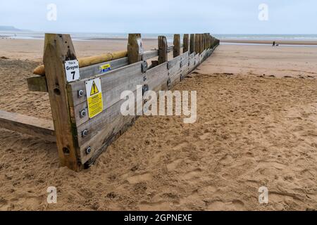 A wooden groyne on the beach to help stop coastal erosion at Dawlish Warren, Dawlish, Devon, England, UK Stock Photo