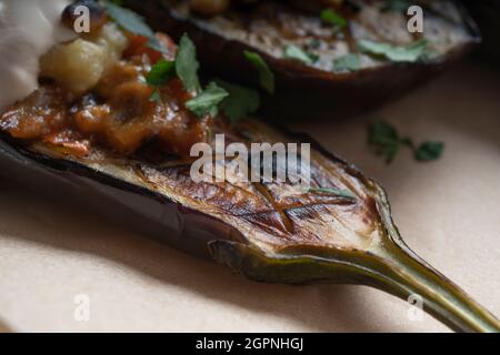 Stuffed eggplant with pine nuts and filling, vegetarian food Stock Photo