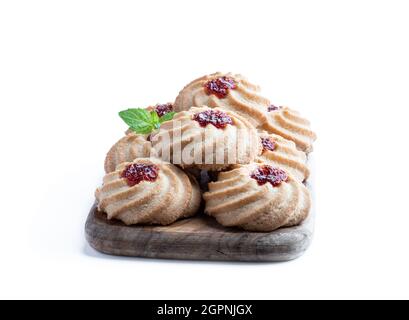Qurabiya  cookie shortbread with jam on serving board isolated on white Stock Photo