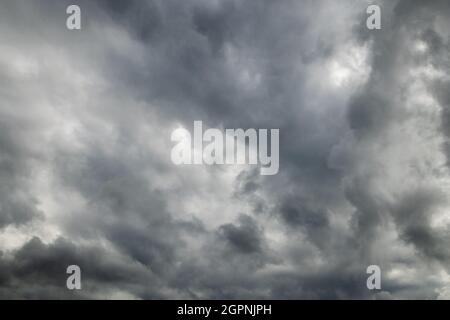 grey incoming storm clouds full frame background Stock Photo