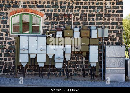 Umea, Norrland Sweden - June 8, 2021: electrical madness on an old house facade Stock Photo