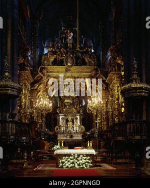 Spain. Cathedral of Santiago. Main Chapel. Altar with the image of the Apostle St. James (12th century), sculpted in stone. The baldachin that covers the altar is a work of Domingo de Andrade (1639-1712), from the 17th century, with Solomonic columns and supported by angels. Santiago de Compostela. Province of A Coruña. Galicia. Stock Photo