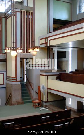 Frank Lloyd Wright (1867-1959). American architect and interior designer. Unity Temple, 1905-1907. Headquarters of the Unitarian Universalist Church. Partial view of the interior of the sanctuary. Oak Park. Near Chicago. State of Illinois. United States. Stock Photo