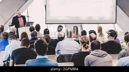 Male speeker having talk at public event. Stock Photo