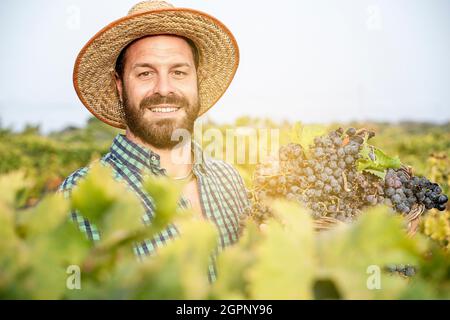 satisfied farmer in the vineyard Stock Photo