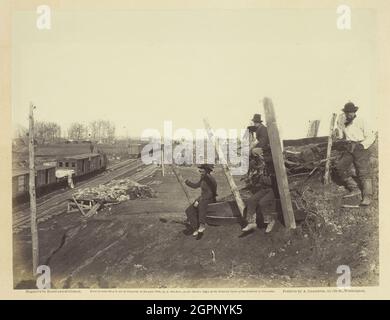 Manassas Junction, March 1862. [Scene from the American Civil War, soldiers near railway track with goods wagons]. Albumen print, pl. 10 from the album &quot;Gardner's Photographic Sketch Book of the War, vol. 1&quot; (1866). Stock Photo