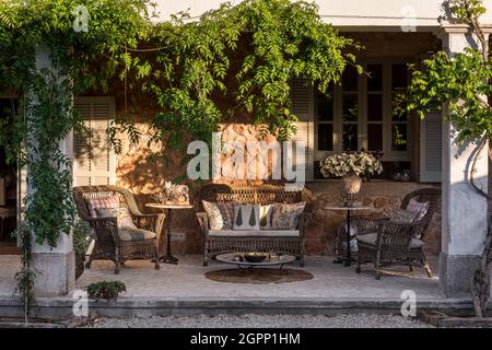 Wicker furniture in evening light, Spanish villa, Mallorca Stock Photo