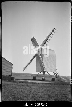 Chillenden Windmill, Chillenden, Goodnestone, Dover, Kent, 1929. A view of Chillenden Windmill, showing the post mill intact. This open-trestle post mill was built in 1868 and was still in good condition when the photograph was taken, with a new midling and two new sails having been fitted in 1927. It ceased work in 1949, but was restored in 1958. Stock Photo