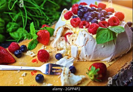 Delicious pavlova meringue with raspberries, strawberries and blueberries Stock Photo