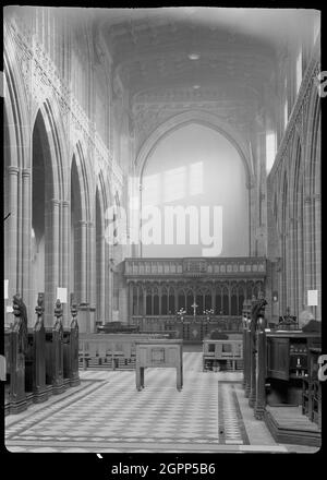 Cathedral Church of St Mary, Fennel Street, Manchester, 1942. An interior view of Manchester Cathedral, or St Mary's Cathedral Church, showing the east end of the nave. Originally a collegiate parish church built between c1422 and 1520, the church received cathedral status in 1847. It underwent restoration or rebuilding between 1814-1815, 1862-1868, 1885-1886 and 1898. The cathedral has a west tower with a west porch and choir rooms, an aisled nave with north and south chapels and porches. The choir and presbytery are aisled, and have chapels north of the north aisle, and a vestry, library, ch Stock Photo