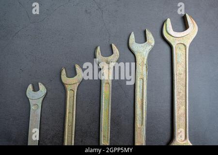 A set of new wrenches made of durable alloy of different calibers for tightening nuts and bolts Stock Photo