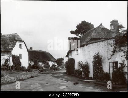 Porlock Weir, Porlock, West Somerset, Somerset, 1930s. The view looking south east along the B3225 at Porlock Weir with Gibraltar Cottages to the left and The Old Reading Rooms to the right. Stock Photo