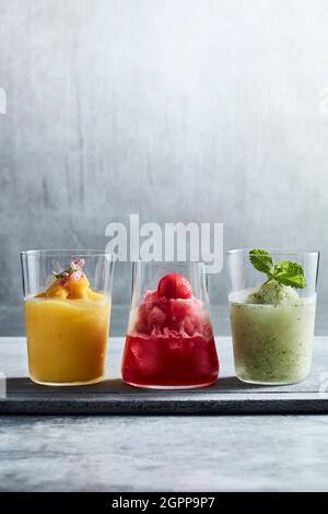 Studio shot of colorful fruit slushies in glasses Stock Photo