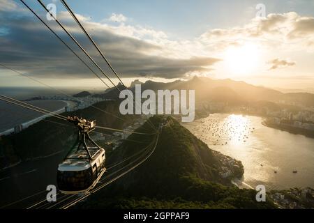 Brazil, Rio de Janeiro, Cable car on Sugarloaf Mountain at sunset Stock Photo