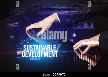 Businessman touching huge screen concept Stock Photo