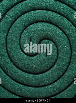 group of mosquito repellent coil, dark green tone closeup abstract or background texture Stock Photo