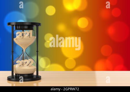 New 2022 Year Concept. Sand Falling in Hourglass Taking the Shape from 2021 to 2022 year on a wooden table. 3d Rendering Stock Photo