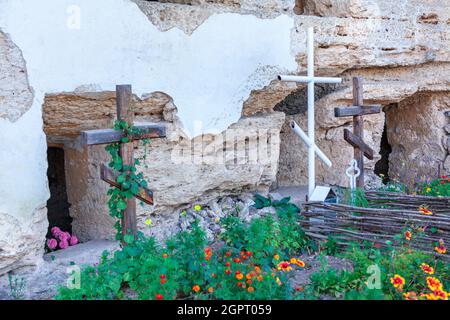 Christian Religious Cross near Grotto . Monastery in the cliff in Tipova Moldova Stock Photo