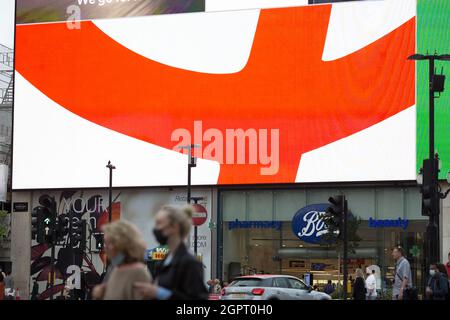 A Coca Cola advertisement supporting England is displayed on a large electric board in central London, 10 July 2021 ahead of the Euro final. Stock Photo