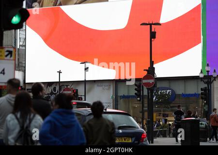 A Coca Cola advertisement supporting England is displayed on a large electric board in central London, 10 July 2021 ahead of the Euro final. Stock Photo