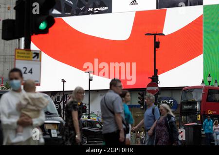 A Coca Cola advertisement supporting England is displayed on a large electric board in central London, 10 July 2021 ahead of the Euro final. Stock Photo