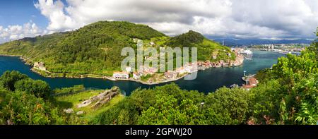 View of the fishing village along with its waterfront and boats in Pasai Donibane, Gipuzkoa, Basque Country, Spain Stock Photo
