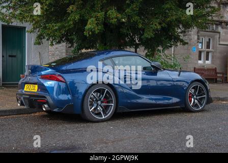 2021 Model Dark Blue Toyota GR Supra Grand Tourer Motor Car rear drivers side view of blue fifth 5th generation 2021 model toyota gr supra gt right ha Stock Photo