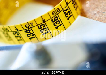 close-up of a yellow tailor's tape measure Stock Photo
