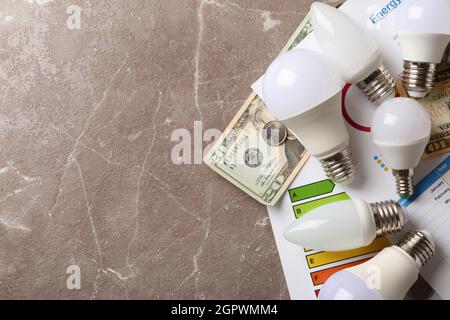 Energy saving concept on gray textured background. Stock Photo