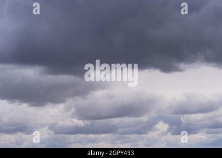Background, storm clouds illuminated by sunlight Stock Photo