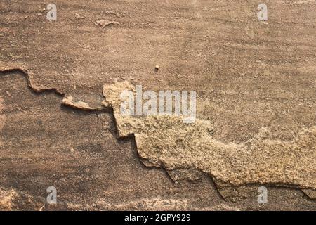 close up of a reddish sandstone surface Stock Photo