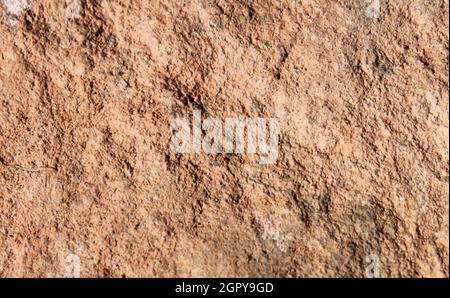 close up of a reddish sandstone surface Stock Photo
