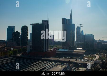 Panorama of Milan skyline, Italy. Porto Nuovo business district with train station in front view. Panoramic view of Milan in summer with the tall mode Stock Photo