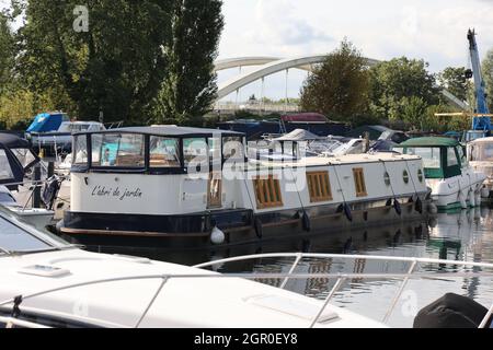 Narrowboats moored in Walton Marina on the river Thames, Surrey, UK Stock Photo