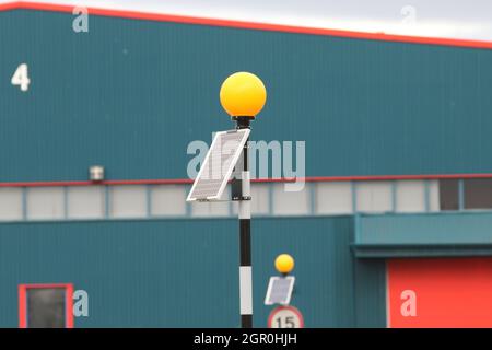 Solar Powered Belisha Beacon on industrial estate Stock Photo