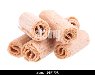 Crispy wafer rolls isolated on white background. Cinnamon flavored waffle. Stock Photo