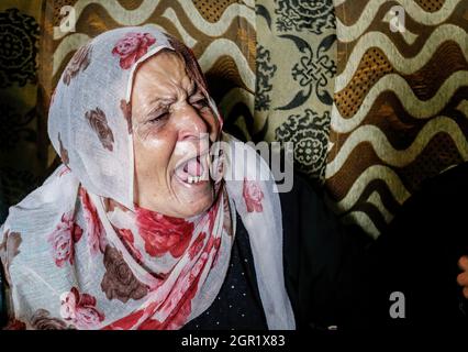 Gaza, Palestine. 30th Sep, 2021. The mother is seen mourning during the funeral of Palestinian Muhammad Abu Ammar, who was shot dead by Israeli soldiers at the border fence between Israel and Gaza, according to the Ministry of Health. Credit: SOPA Images Limited/Alamy Live News Stock Photo