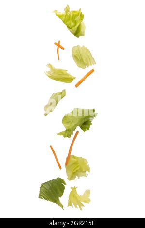 Vertical shot of falling vegetables isolated on white background Stock Photo