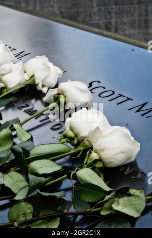 National September 11 Memorial on the 20th Anniversary of the attack had many flowers on the Wall of Names, New York City, USA  2021 Stock Photo