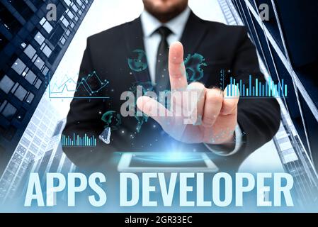 Text showing inspiration Apps Developer. Internet Concept Graphic artist Software Programmer and Analyst Experts Hands Holding A Mobile Phone In Stock Photo