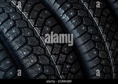 Close-up Black New Studded Tires For Winter Driving In A Car