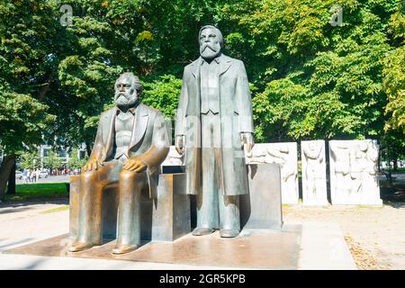 Berlin, Germany - April 17th 2011: Two bearded men statues of Karl Marx and Friedrich Engels located in Marx-Engels-Forum in  city, Marx and Engels we