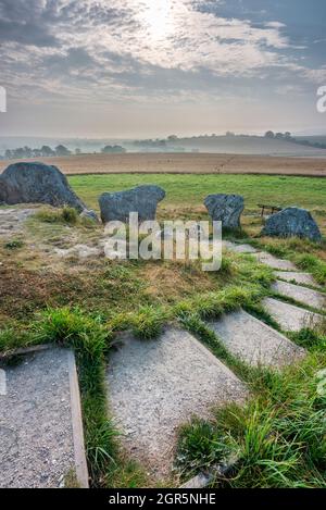 Steps leading down from the top of the Ancient Neolithic burial chambers and historic landmark,built 3650 years BC in the southwest of England. Stock Photo